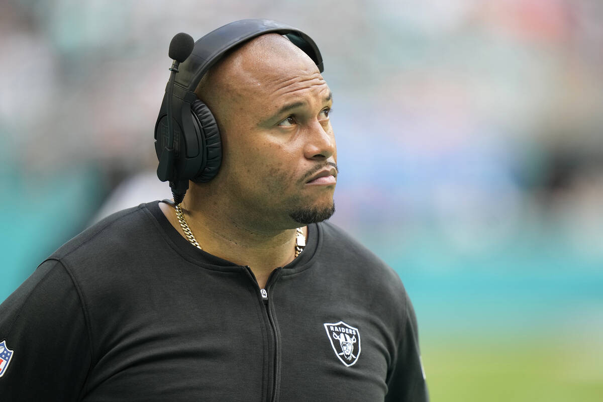 Las Vegas Raiders head coach Antonio Pierce watches the game during the second half of an NFL f ...