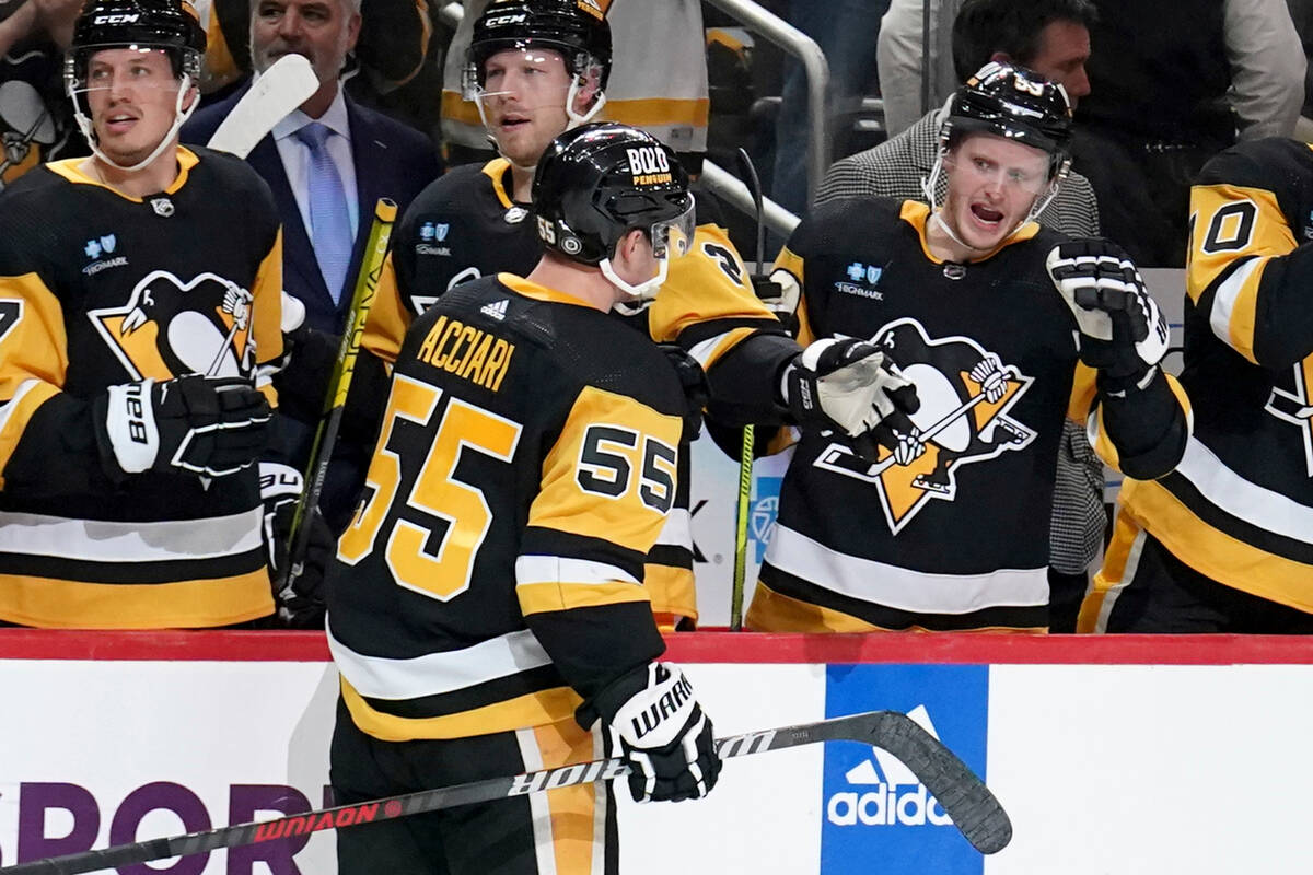 Pittsburgh Penguins' Noel Acciari (55) returns to the bench after scoring against the Vegas Gol ...
