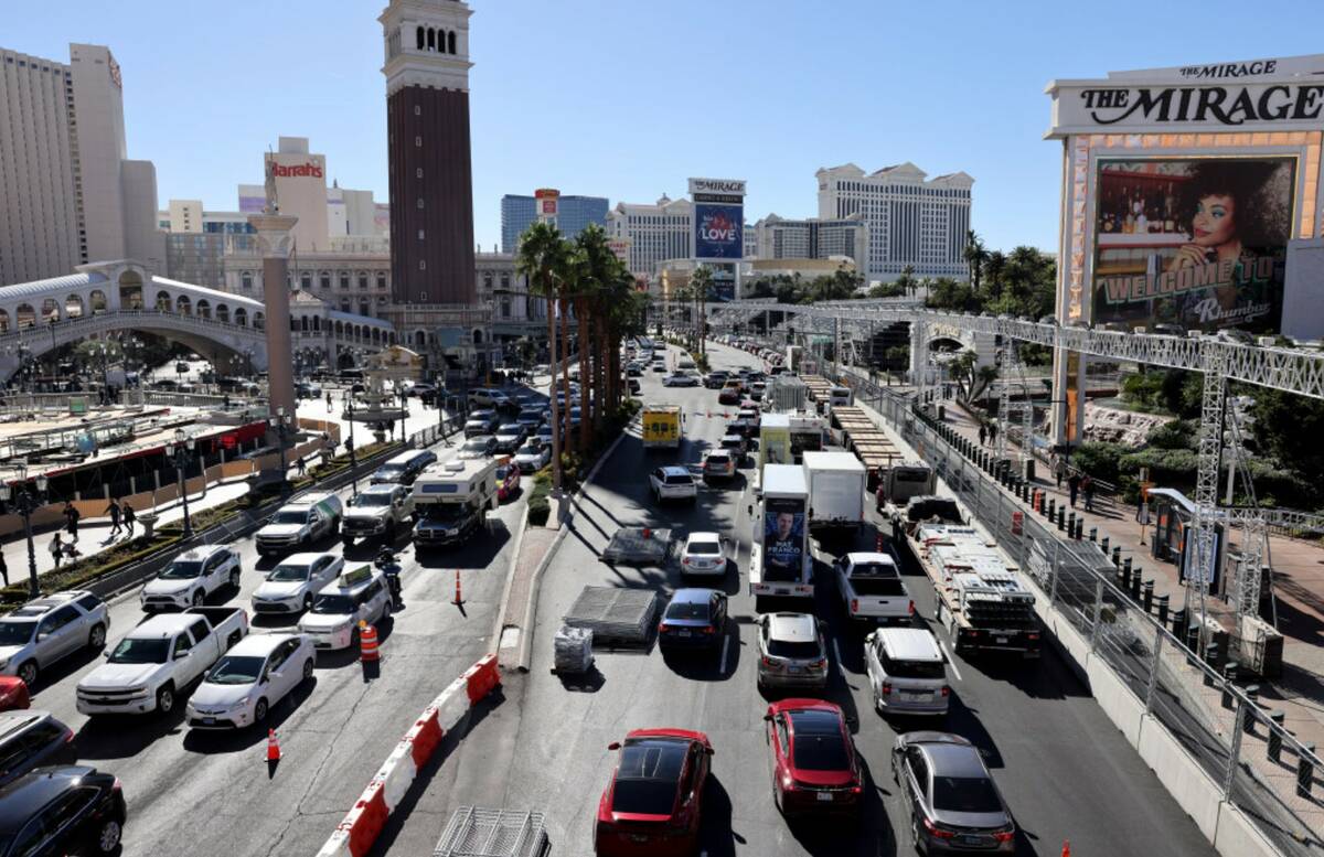 Cars make their way down the Strip on the Formula One race course south of Spring Mountain Road ...