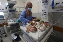 A nurse cares for prematurely born Palestinian babies that were brought from Shifa Hospital in ...
