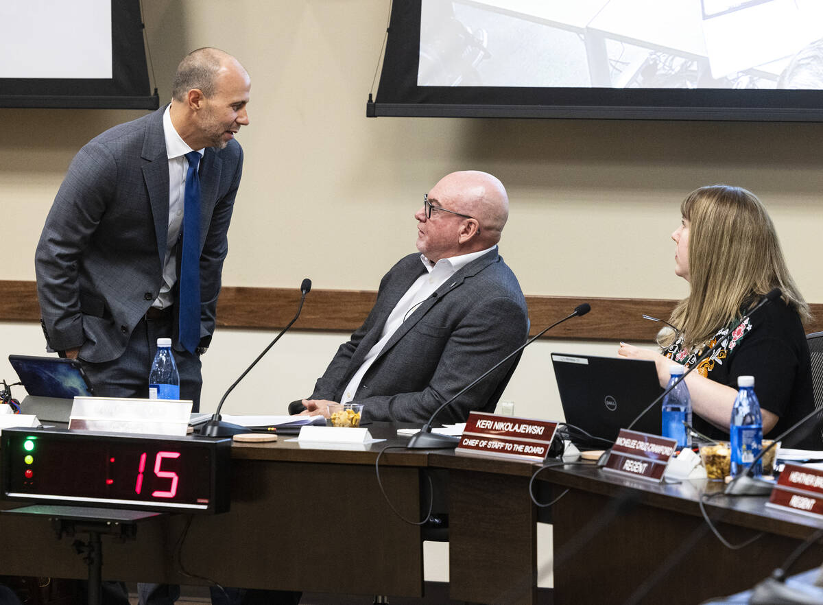 Byron Brooks, center, chairman of the state's Board of Regents, James Martinez, left, chief gen ...