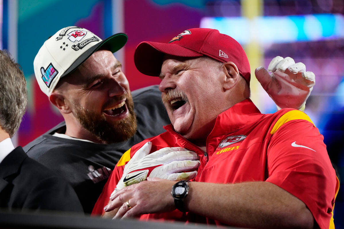 Kansas City Chiefs head coach Andy Reid, right, and Travis Kelce (87) celebrate their win after ...