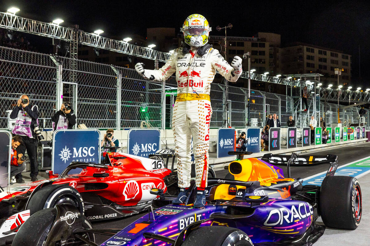Red Bull Racing driver Max Verstappen celebrates his win atop his Red Bull Racing car following ...