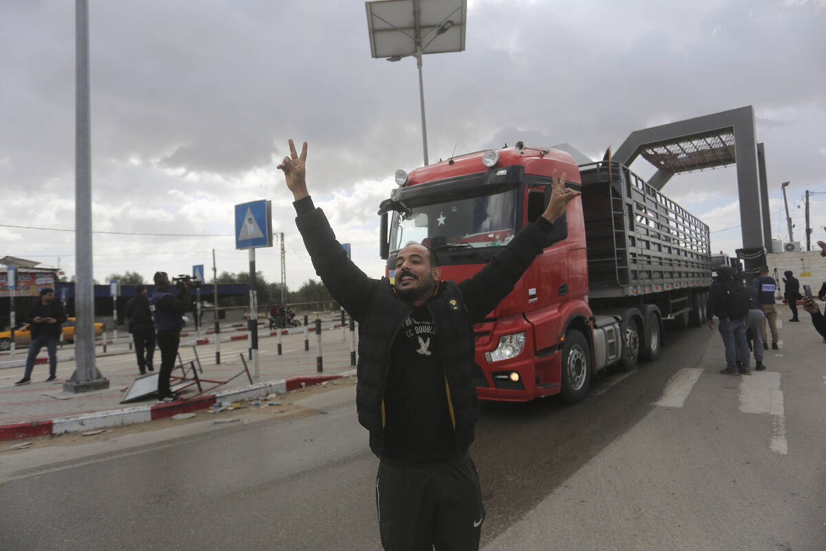 A Jordanian humanitarian aid convoy enters the Gaza Strip from Egypt in Rafah on Monday, Nov. 2 ...