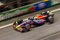 Red Bull Racing driver Sergio Perez speeds down the front straightaway during the Las Vegas Gra ...