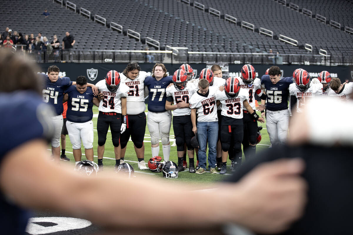 Lake Mead and Pershing County pray together after the Eagles won their Class 2A high school foo ...