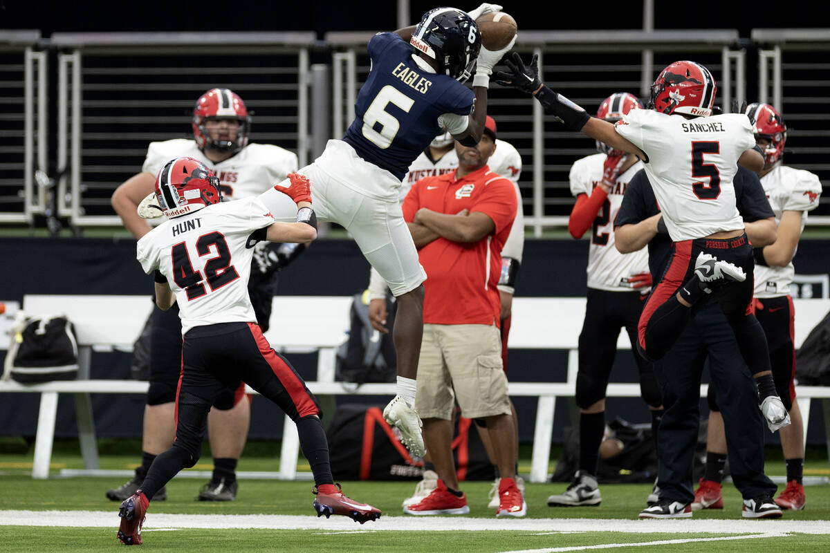 Lake Mead wide receiver Jaylen Hardy (6) catches a pass while Pershing County’s Luis San ...