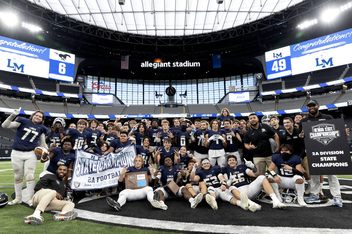 Lake Mead poses for photos after winning the Class 2A high school football championship game ag ...