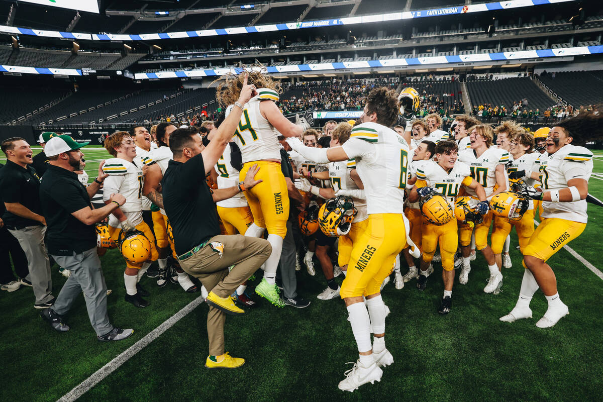 Bishop Manogue celebrates after winning a class 5A Division II state championship game against ...