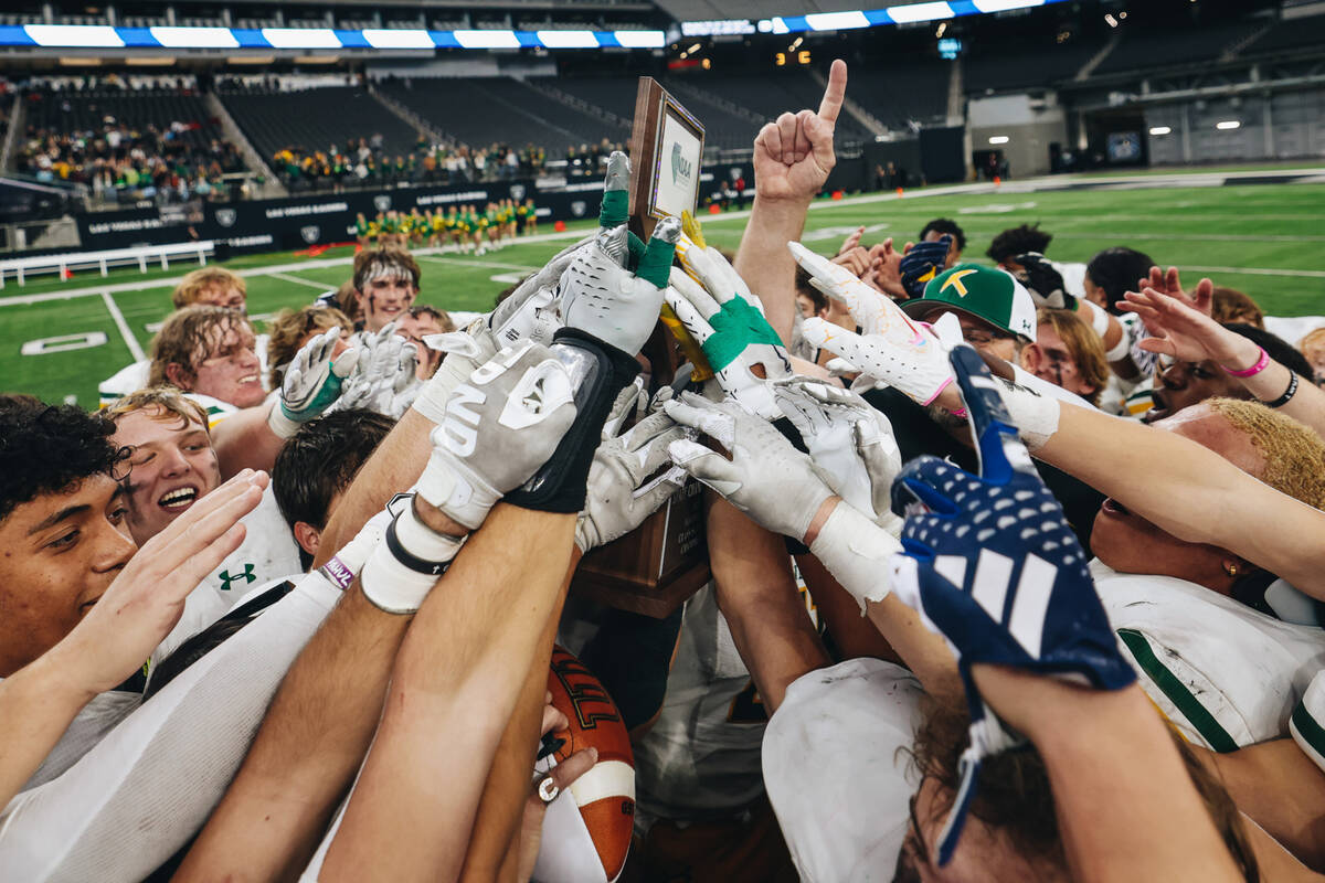 Bishop Manogue celebrates after winning a class 5A Division II state championship game against ...