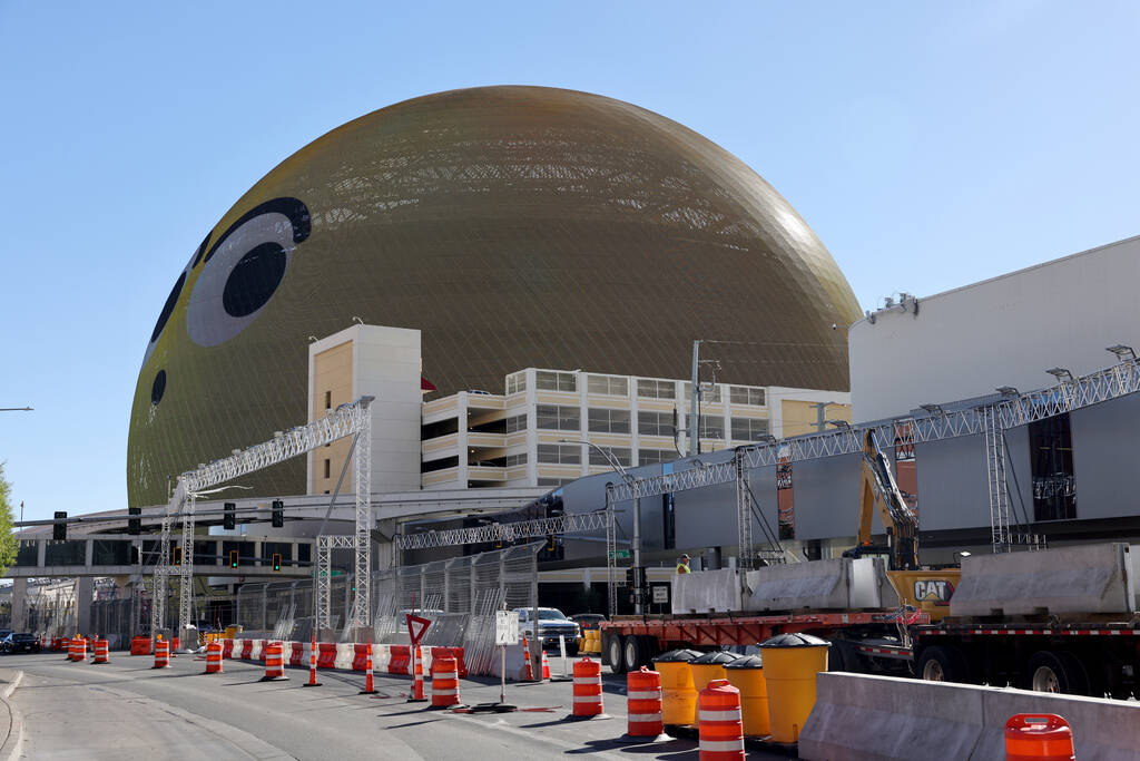 Crews remove barriers from the Formula One Las Vegas Grand Prix race course on Sands Avenue in ...