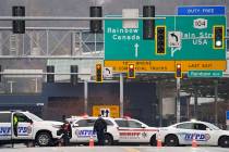 Law enforcement personnel block off the entrance to the Rainbow Bridge, Wednesday, Nov. 22, 202 ...