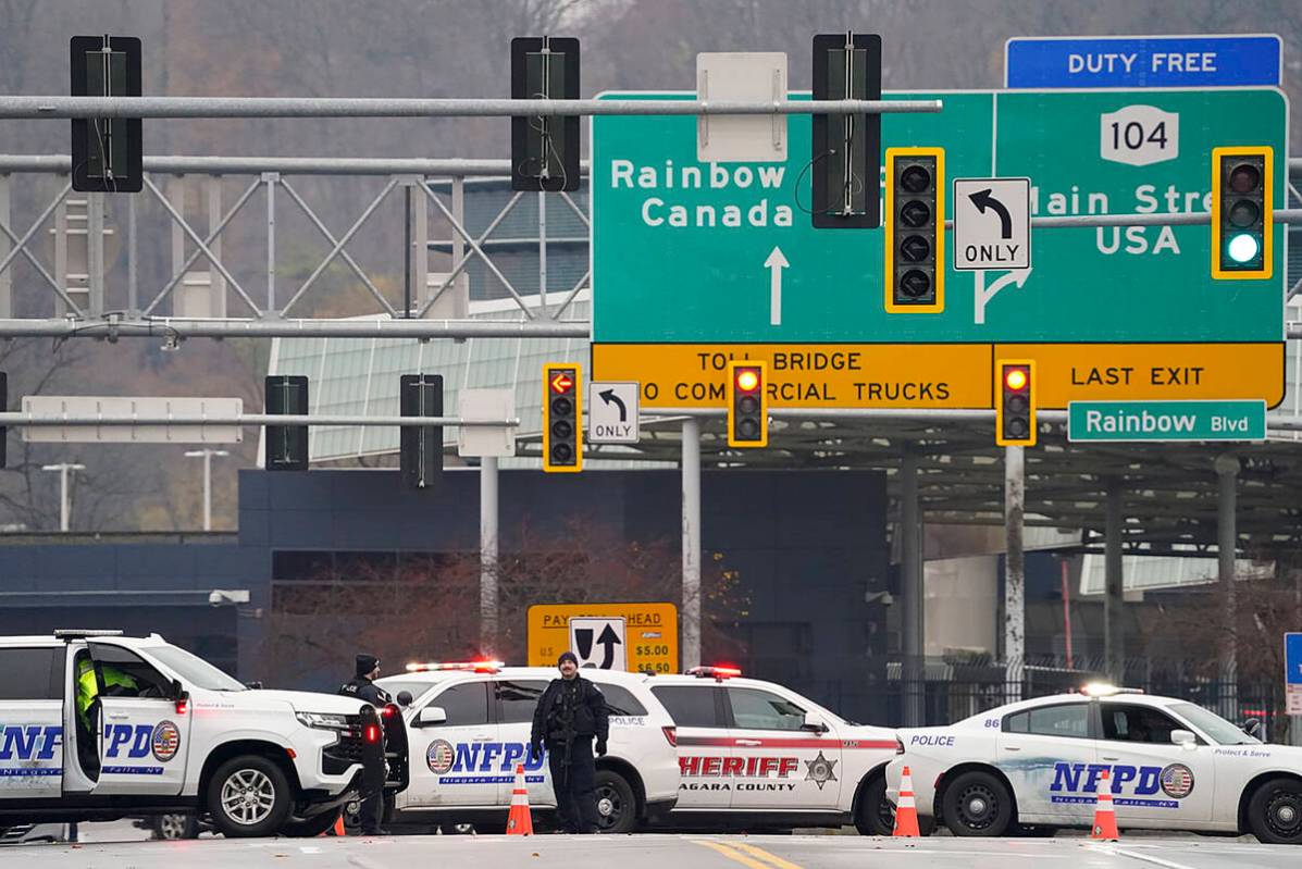 Law enforcement personnel block off the entrance to the Rainbow Bridge, Wednesday, Nov. 22, 202 ...