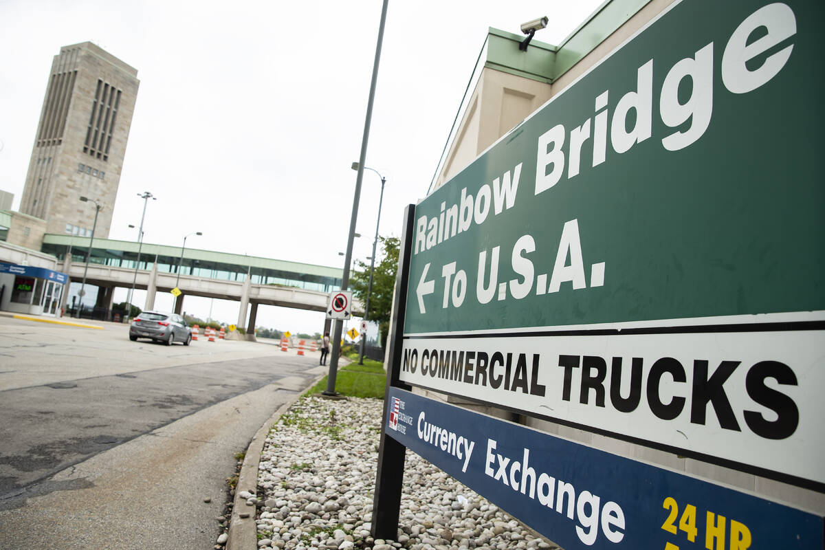 FILE - A vehicle crosses the International Rainbow Bridge from Niagara Falls, Ontario, into Nia ...