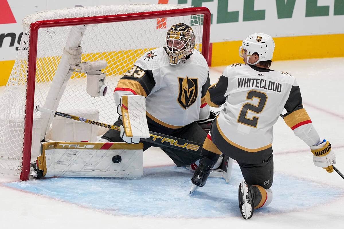 Vegas Golden Knights goaltender Adin Hill (33) stops a shot by the Dallas Stars as defenseman Z ...