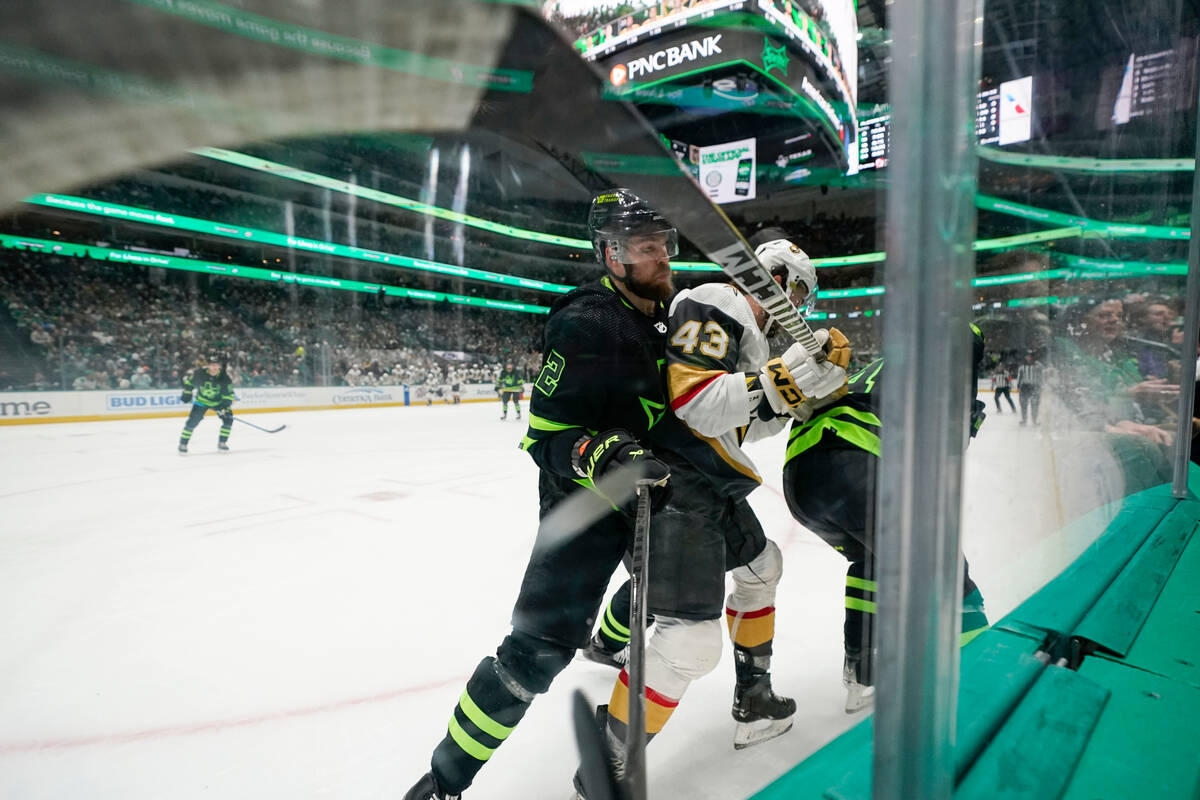 Vegas Golden Knights center Paul Cotter (43) is squeezed between Dallas Stars defenseman Jani H ...