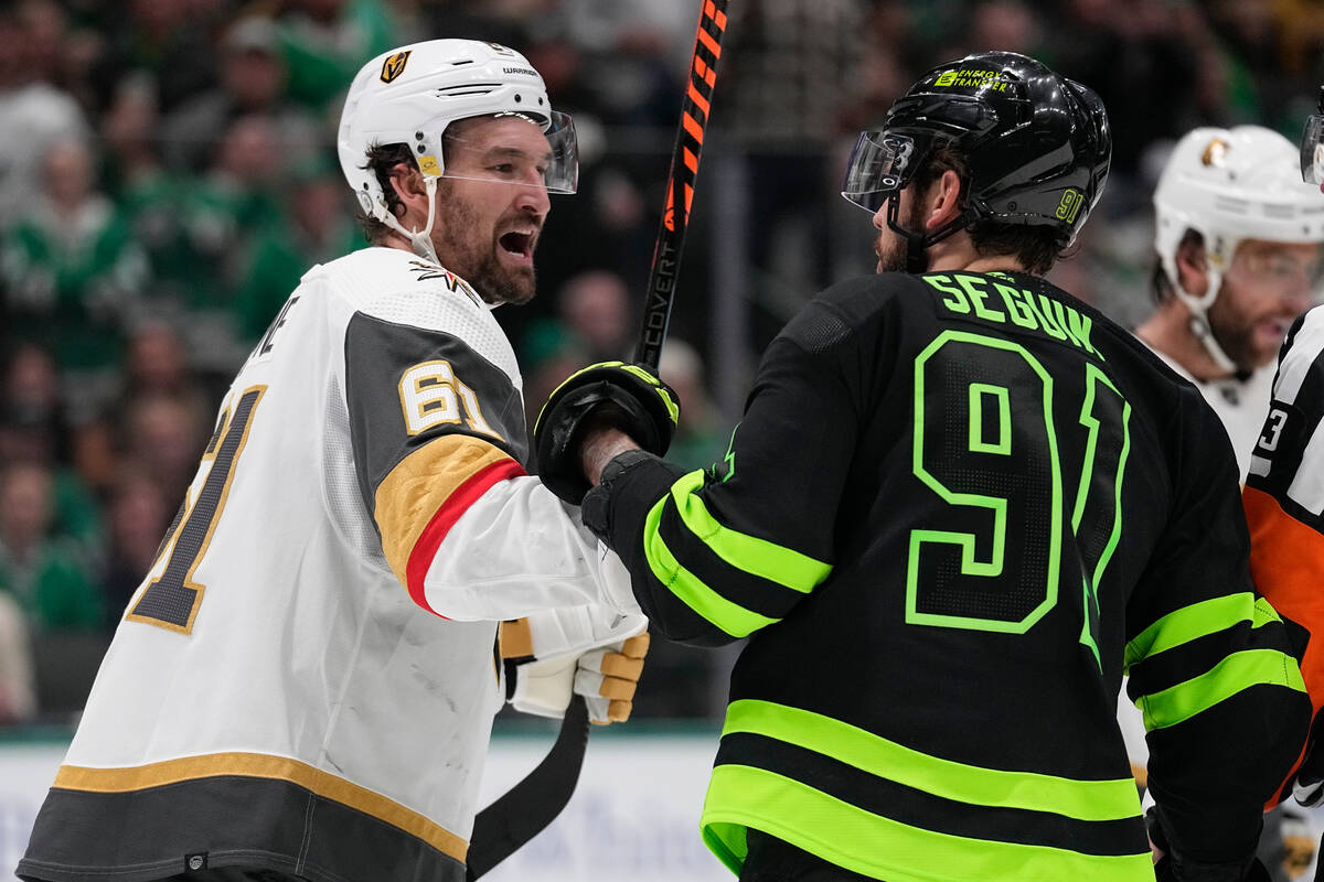 Vegas Golden Knights right wing Mark Stone, left, and Dallas Stars center Tyler Seguin argue du ...