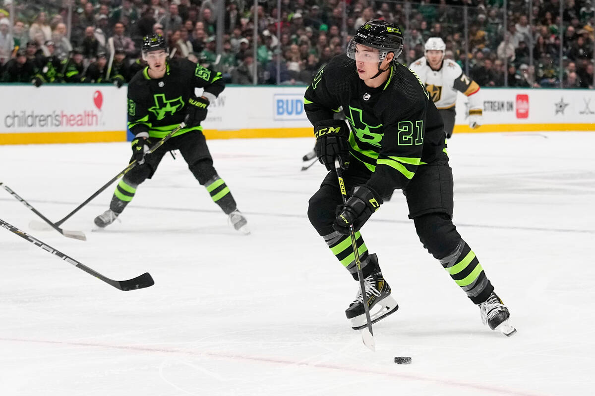 Dallas Stars left wing Jason Robertson (21) skates with the puck before taking a shot against t ...