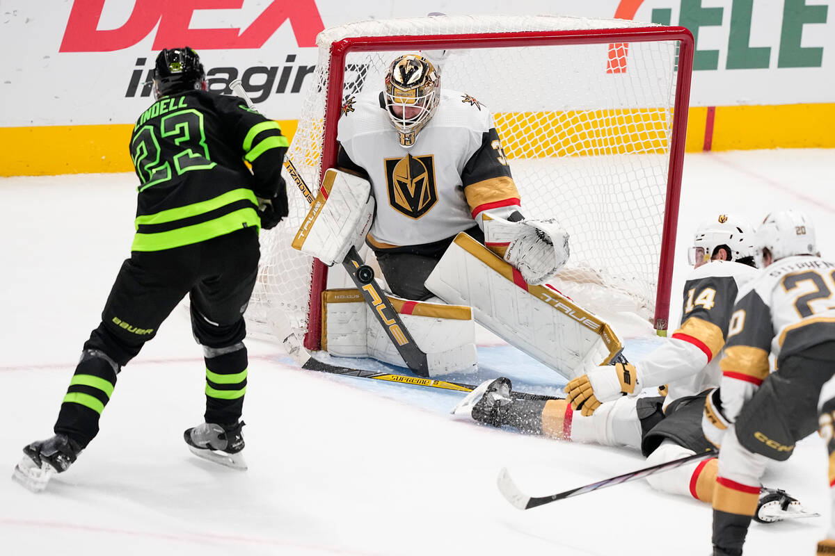 Dallas Stars defenseman Esa Lindell (23) shoots against Vegas Golden Knights goaltender Adin Hi ...