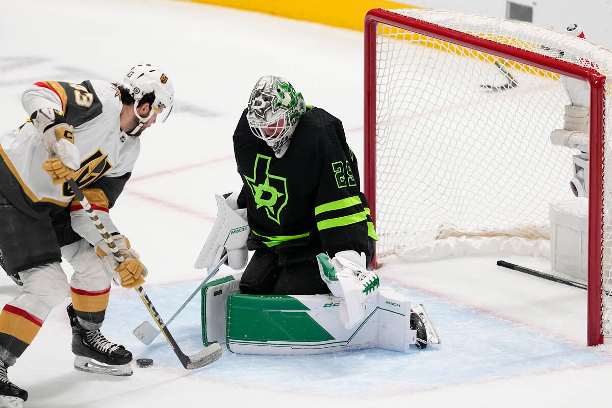 Dallas Stars goaltender Jake Oettinger (29) blocks a shot by Vegas Golden Knights center Paul C ...