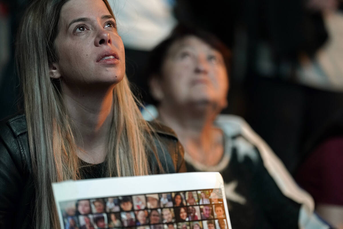 People participate in a show of solidarity with hostages being held in the Gaza Strip, near the ...