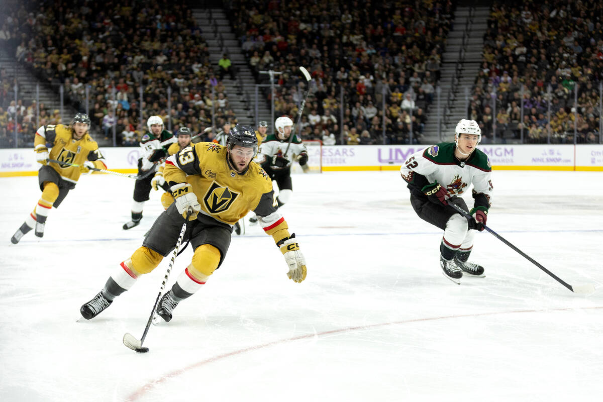 Golden Knights center Paul Cotter (43) skates with the puck before attempting a goal while Coyo ...