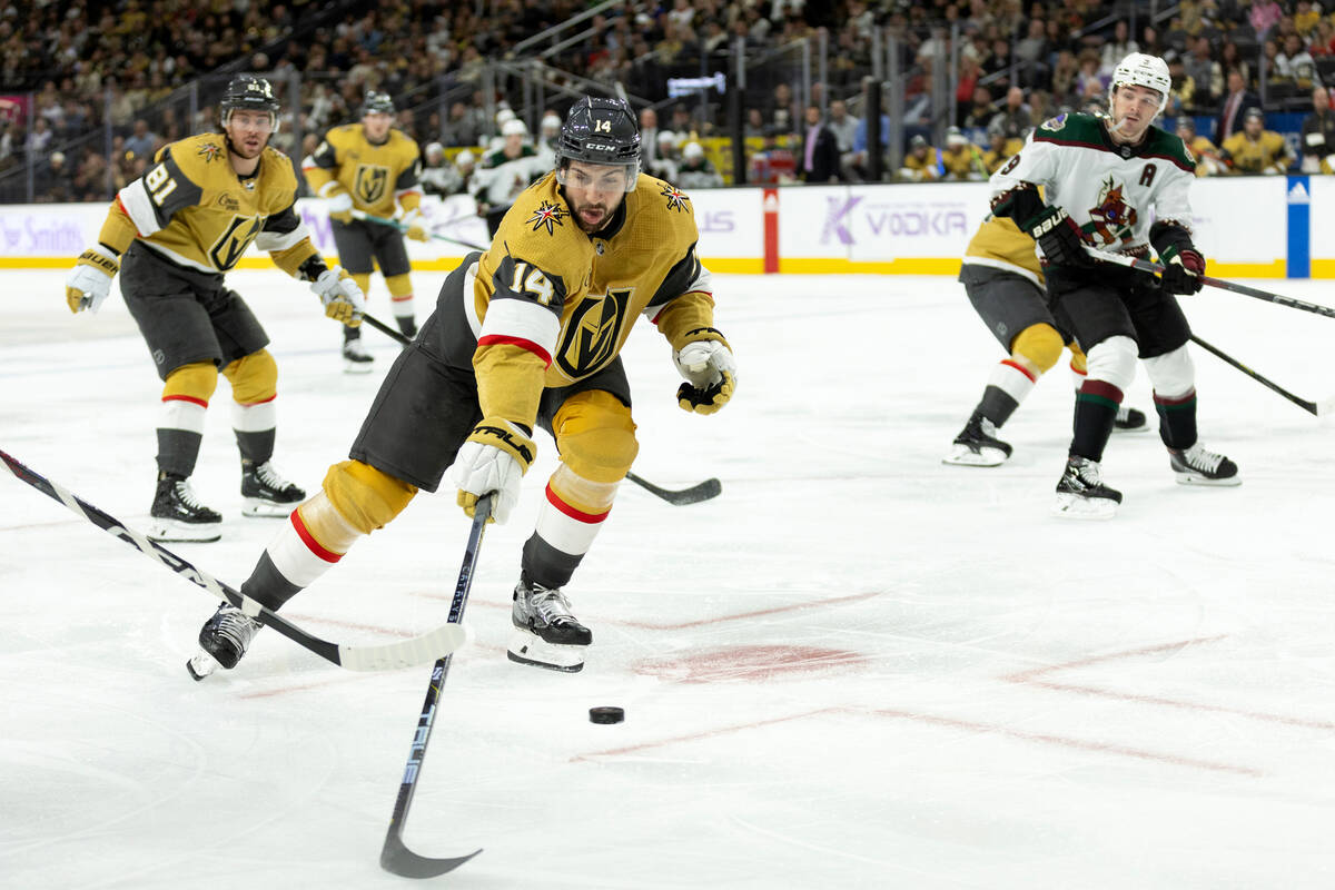 Golden Knights defenseman Nicolas Hague (14) reaches to block a Coyotes shot during the third p ...