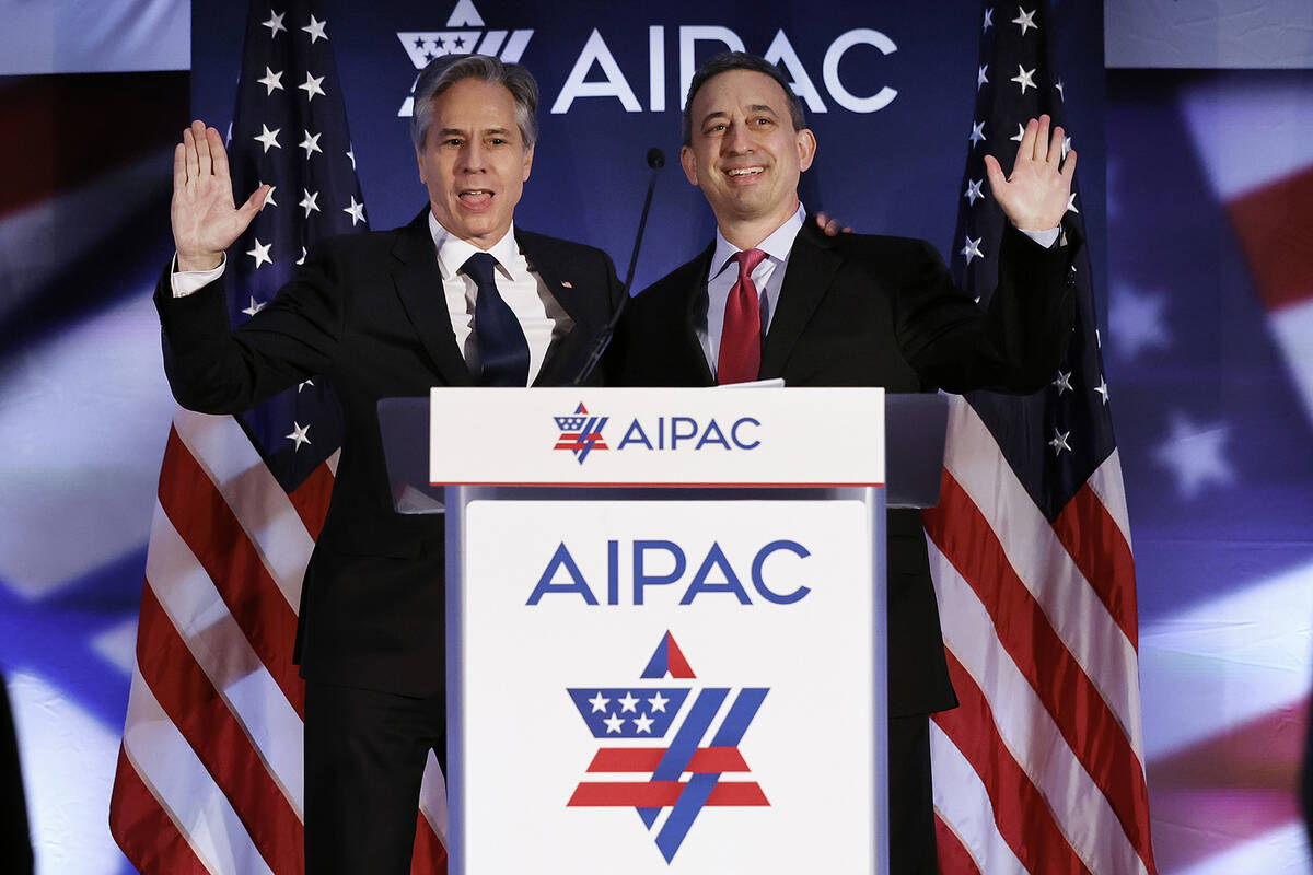 U.S. Secretary of State Antony Blinken (left) is welcomed to the stage by American Israel Publi ...