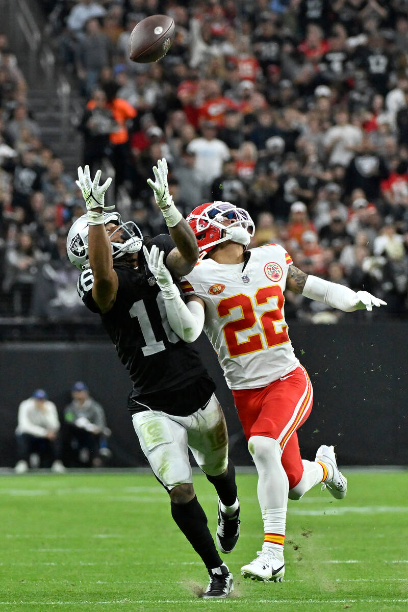 Las Vegas Raiders wide receiver Jakobi Meyers, left, catches a pass against Kansas City Chiefs ...