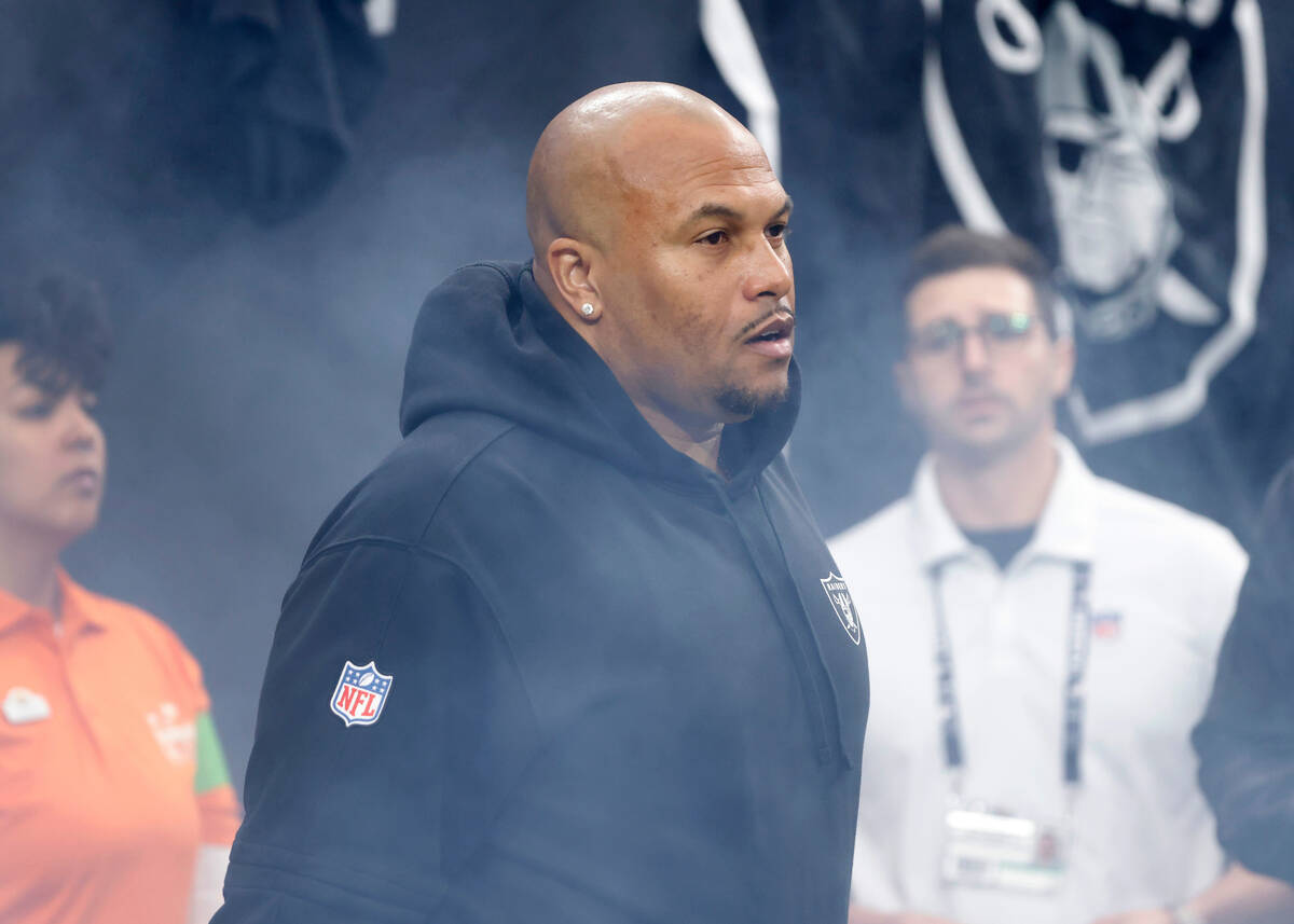 Raiders Interim Coach Antonio Pierce takes the field as his team prepares to face Kansas City C ...