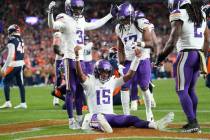 Minnesota Vikings quarterback Joshua Dobbs (15) celebrates after rushing for a touchdown as Min ...