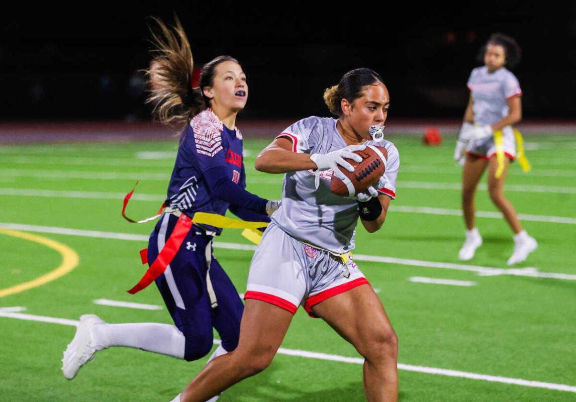 Liberty’s Lolo Westerlund (4) catches the ball during a flag football game between Coron ...