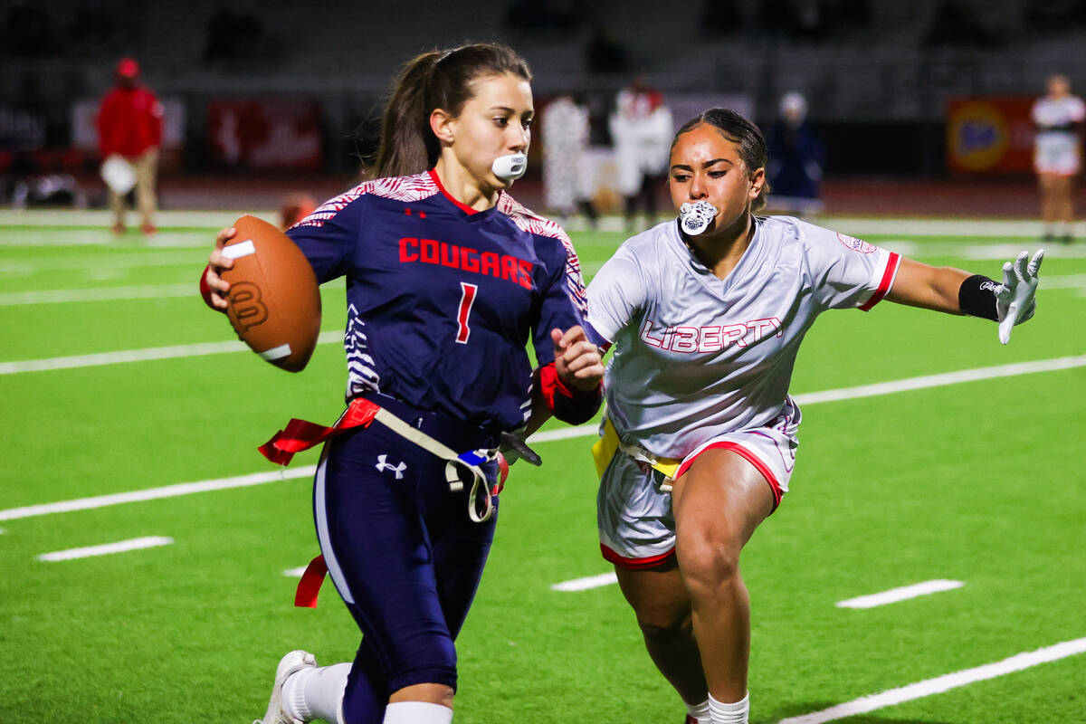 Coronado’s Maci Joncich (1) runs past Liberty’s Lolo Westerlund (4) during a flag ...