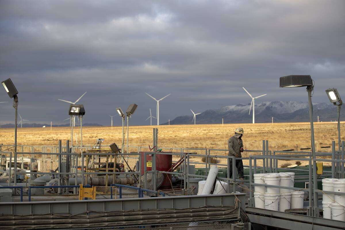 A rig operator walks through a Fervo Energy geothermal drilling site near Milford, Utah Sunday, ...