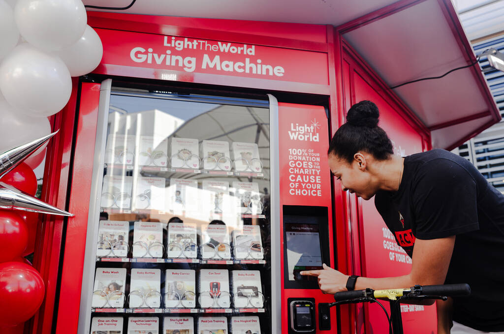 Las Vegas Aces player Kiah Stokes purchases items from The Giving Machine, a “vending ma ...