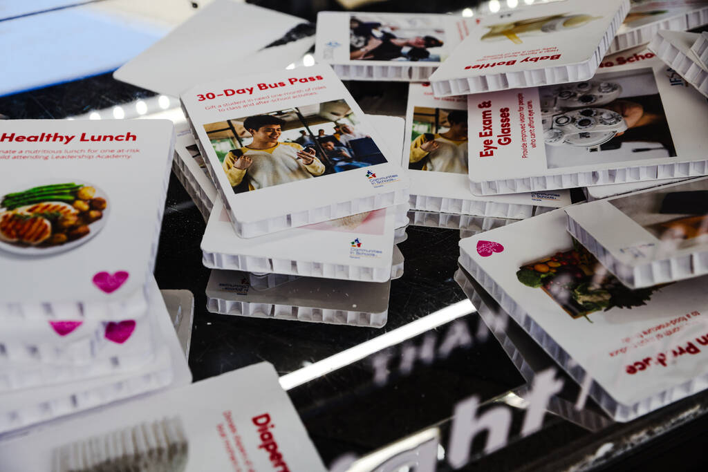 Items purchased rest in the bottom of The Giving Machine at a Giving Tuesday event in Downtown ...