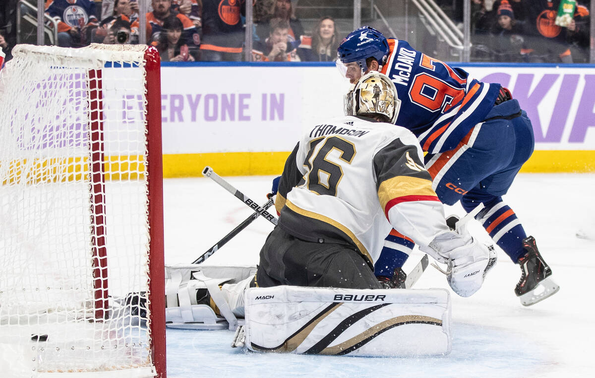 Vegas Golden Knights goalie Logan Thompson is scored on by Edmonton Oilers' Connor McDavid dur ...