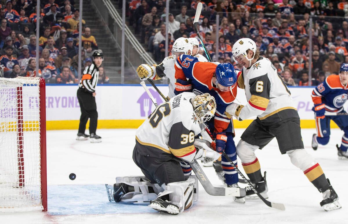 Vegas Golden Knights goalie Logan Thompson (36) is scored on as Kaedan Korczak (6) and Edmonton ...