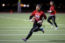 Desert Oasis wide receiver Akiko Higa (29) runs the ball during a high school flag football gam ...