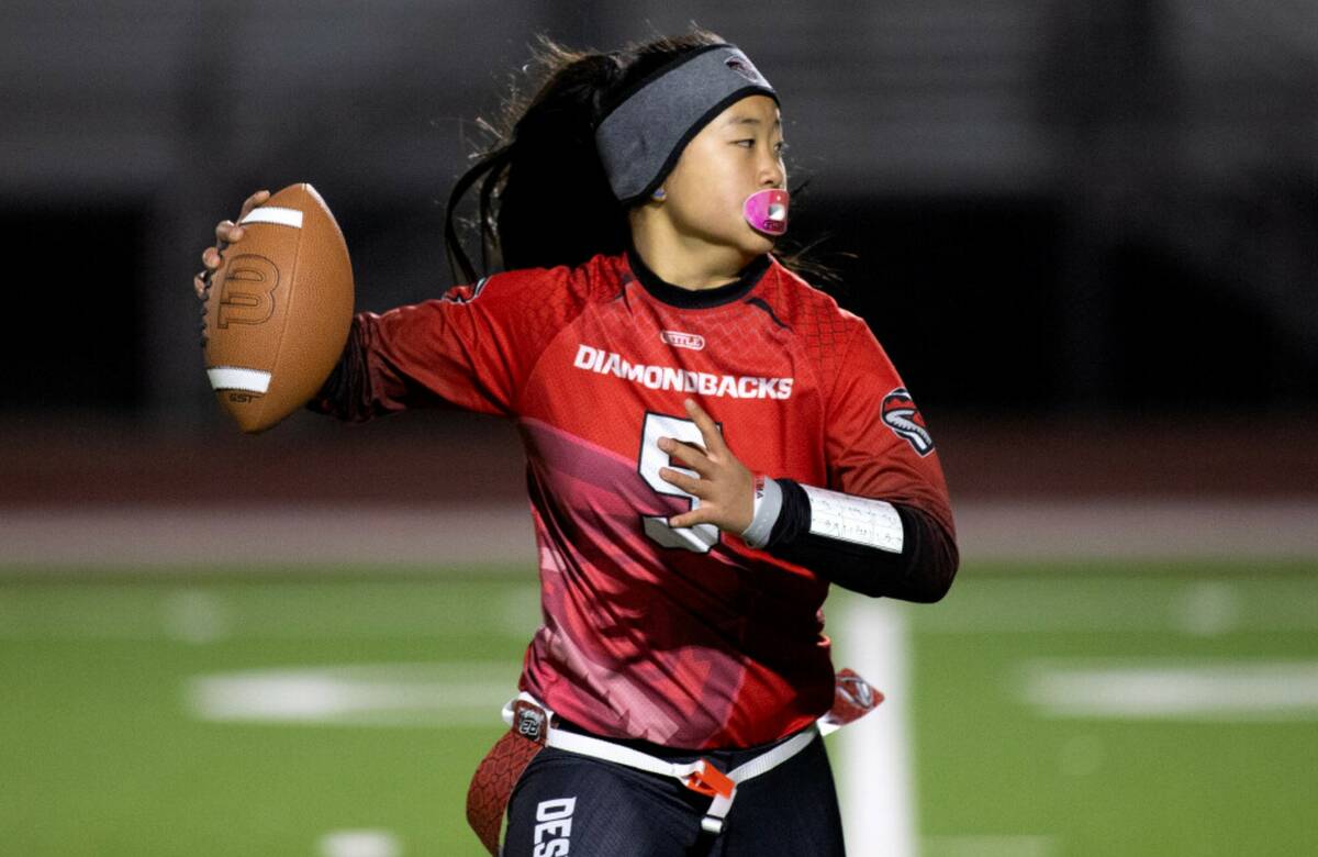 Desert Oasis quarterback Akemi Higa (5) looks to pass during a high school flag football game a ...