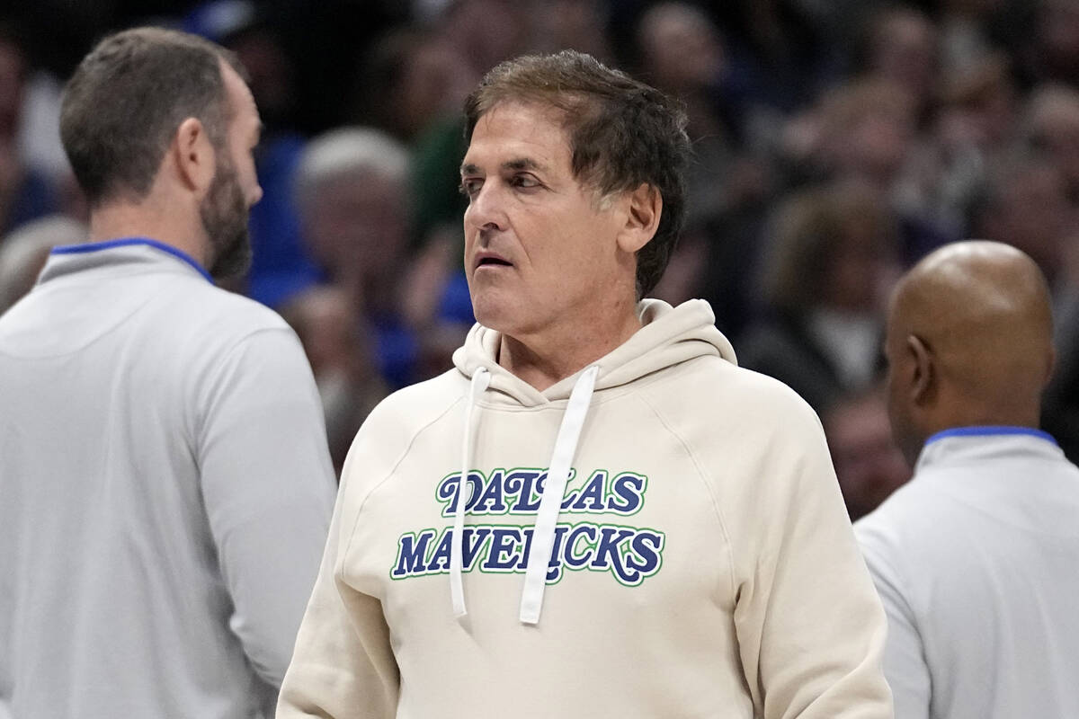 Dallas Mavericks team owner Mark Cuban walks to his seat during the first half of an NBA basket ...