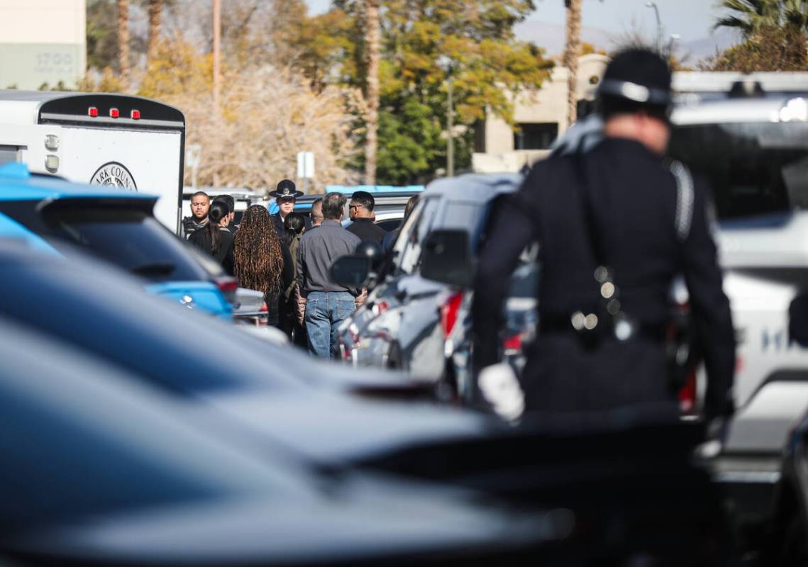 Police greet each other at a procession for a slain Nevada Highway Patrol trooper outside the c ...