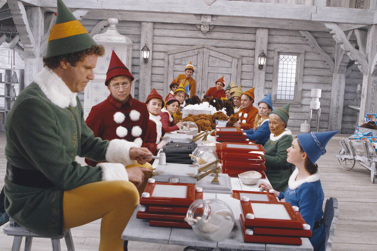 Will Ferrell (left) stars as "Buddy" and Peter Billingsley stars as "Elf Supervisor" in New Lin ...