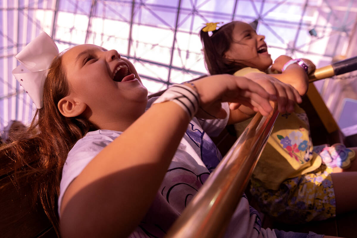 Sisters Zayda Murrietta, 8, left, and Caroline Murrieta, 6, scream on the restored Sand Pirates ...