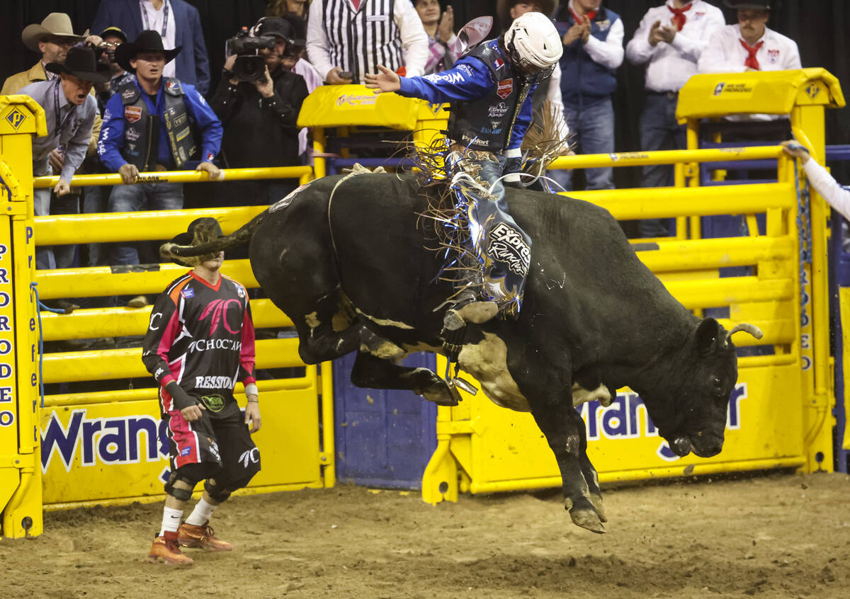 Stetson Wright, of Milford, Utah, rides Relentless while competing in bull riding during the fi ...