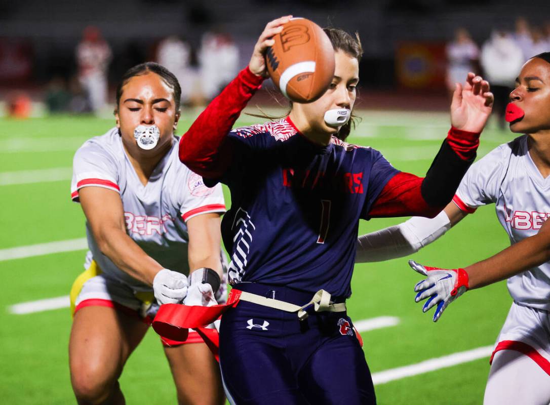 Liberty’s Kiona "Lolo" Westerlund (4) pulls the flag off of Coronado&#x20 ...