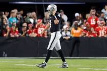 Raiders quarterback Aidan O'Connell (4) leaves the field after being sacked during the second h ...