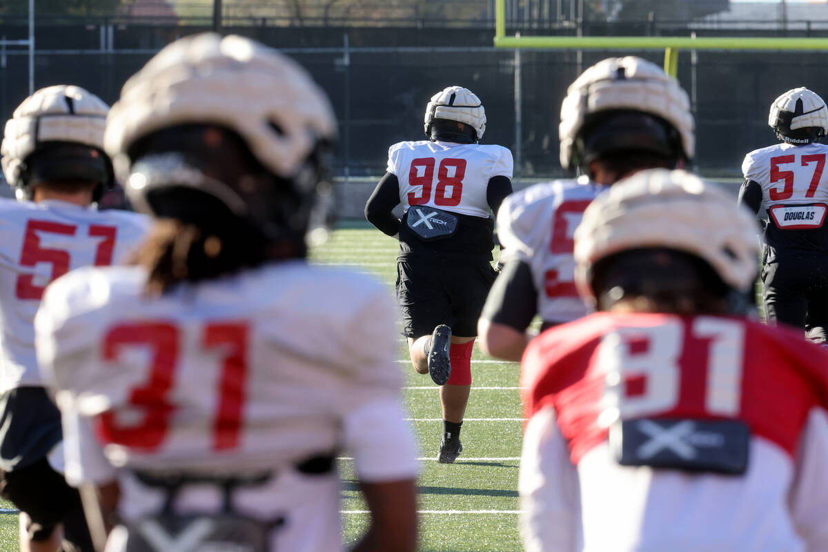 UNLV football walk-on defensive lineman Tatuo Martinson (98) works out during practice at Rebel ...