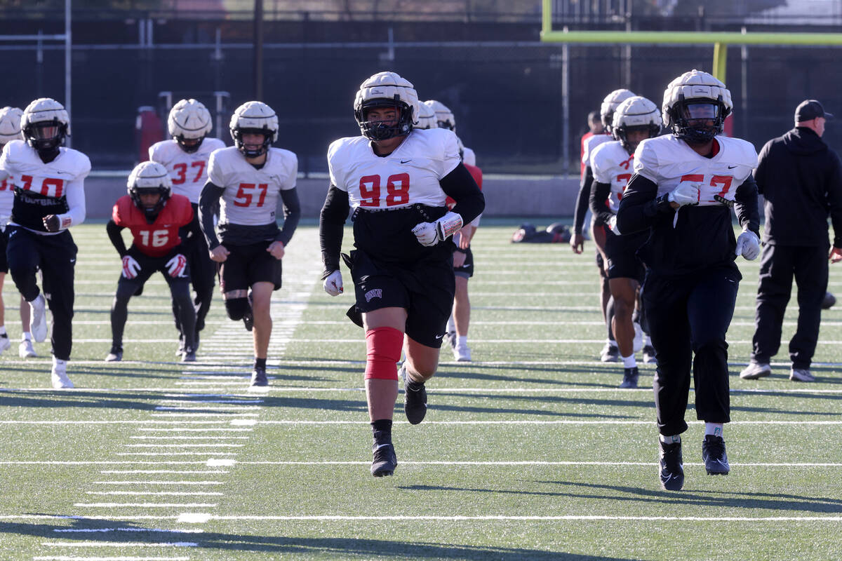 UNLV football walk-on defensive lineman Tatuo Martinson (98) works out during practice at Rebel ...