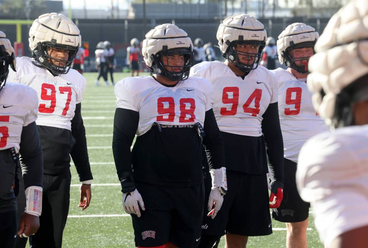 UNLV football walk-on defensive lineman Tatuo Martinson (98) works out during practice at Rebel ...